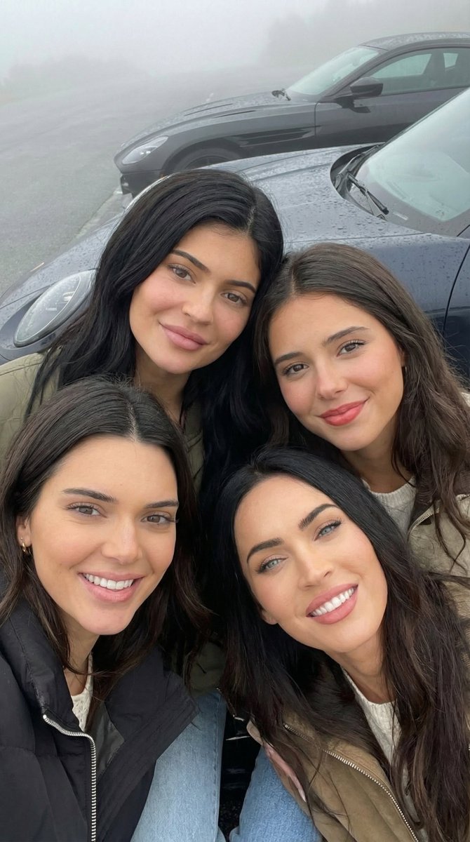 tight close-up top-down shot of four women sitting on luxury sports cars, focusing on faces, Use...