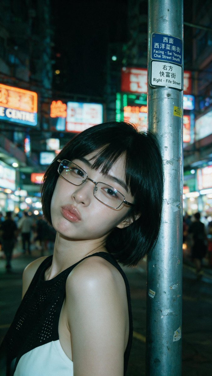 [Seedream 5.0 Pro Prompt] | ar 9:16 2K 电影感夜景特写人像：一位年轻东亚女性，短黑波波头配齐刘海，戴细长方形金属框眼镜。她的左肩和脸侧倚靠在一根风化的银色...